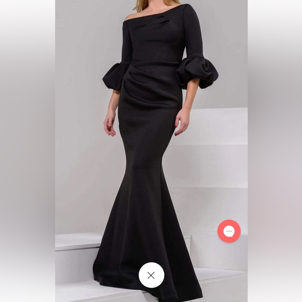 Black Jovani gown. Size 12 no alterations. Scuba material. Paid $700 asking $400